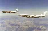 Leading Boeing 707 refuelling a trailing 747 using a rearward extended boom