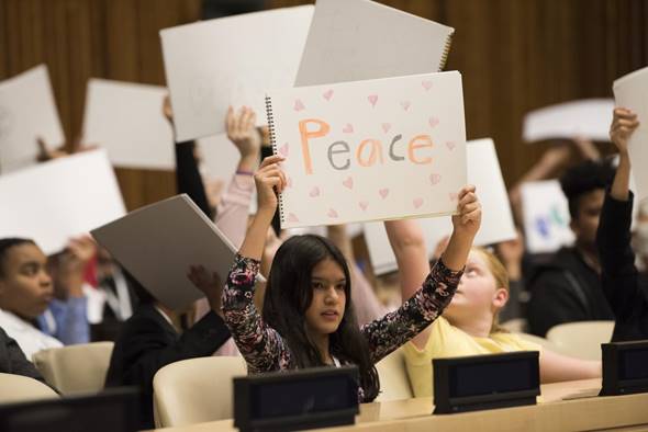 Convention on the Rights of the Child: Children hold up drawings at an event to mark World Childrens Day in the United Nations Headquarters, 2017.