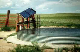 Description: Description: Image of how a solar photovoltaic water pumping system for livestock in a remote location.