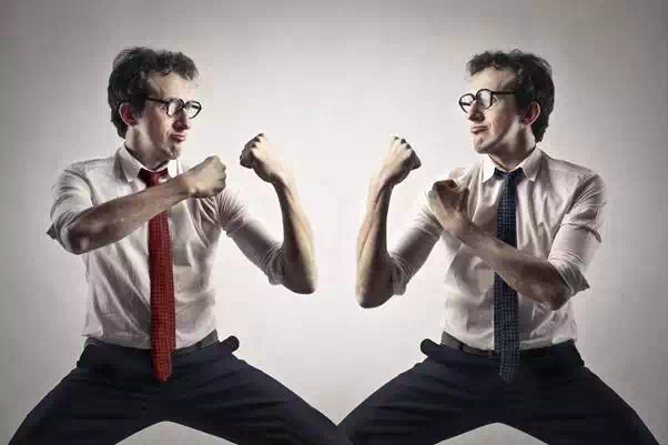 Man in shirt is fighting against his self