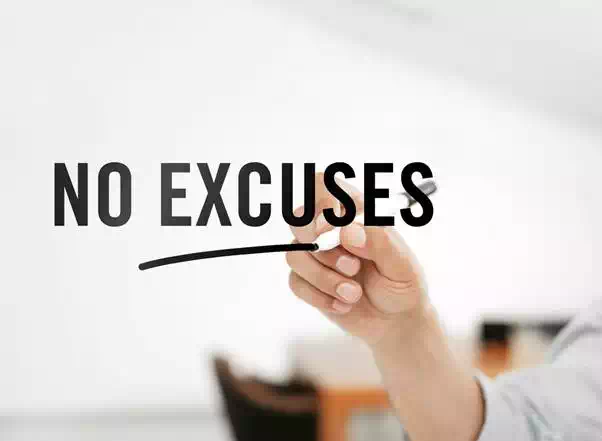 Businessman writing "No excuses" on a virtual board